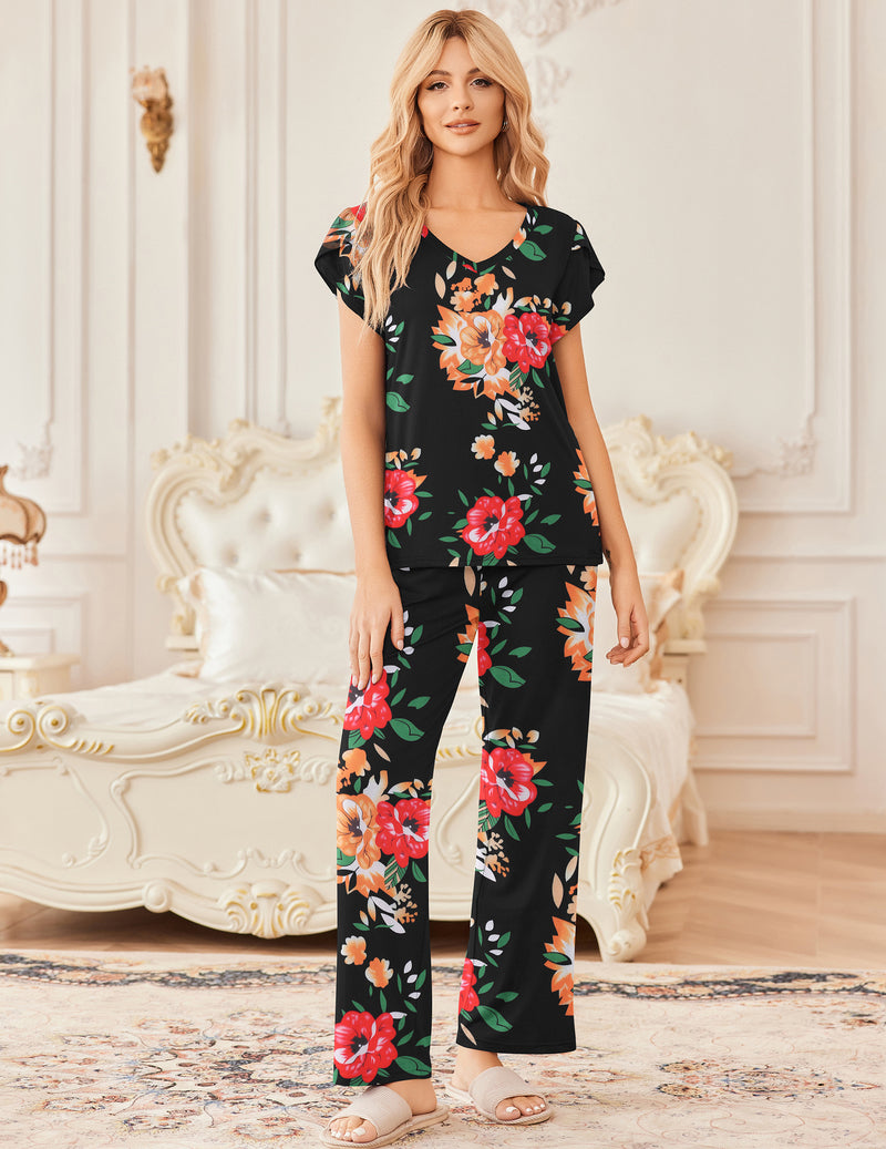 Women’s floral long pajama set: black base with orange, red, and green flowers; wide-leg pants.