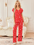 Red short-sleeve pajama top and wide-leg pants with white holiday icon print