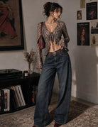 Leopard sheer mesh tie-front shrug with bell sleeves and ruffled hem.