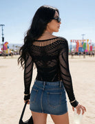 Black fishnet long-sleeve mesh top with wide scoop neck and back cut-out pattern