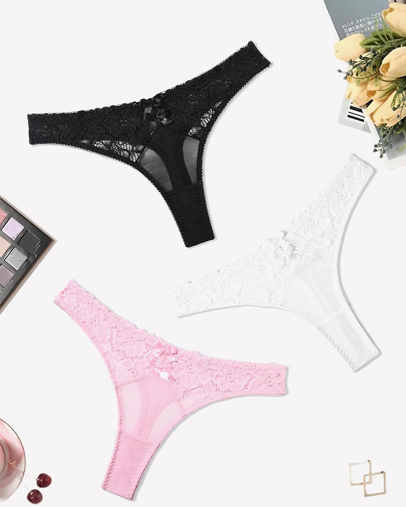 Black, white, and pink lace thongs with bow details. Low waist cheeky panties.