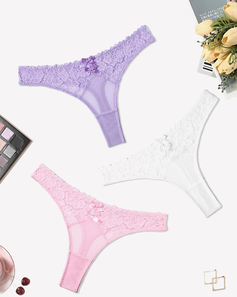 Lace thongs in purple, white, and pink with bow details. Low waist cheeky panties.