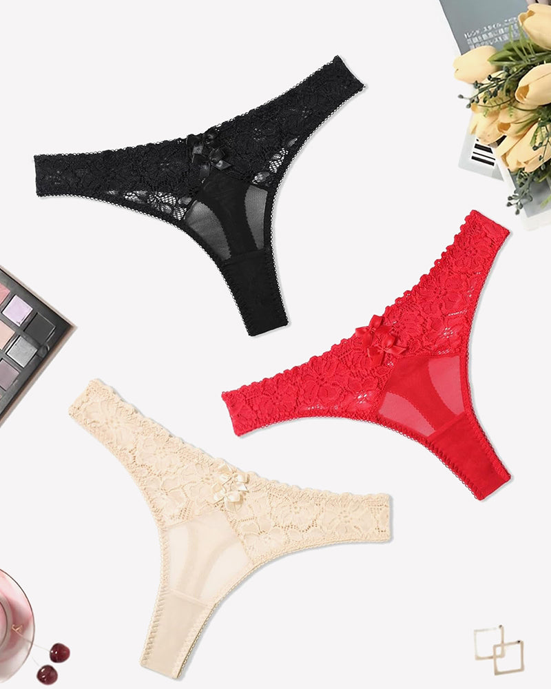 Lace thongs in black, red, and beige with bow details. Low waist cheeky panties.