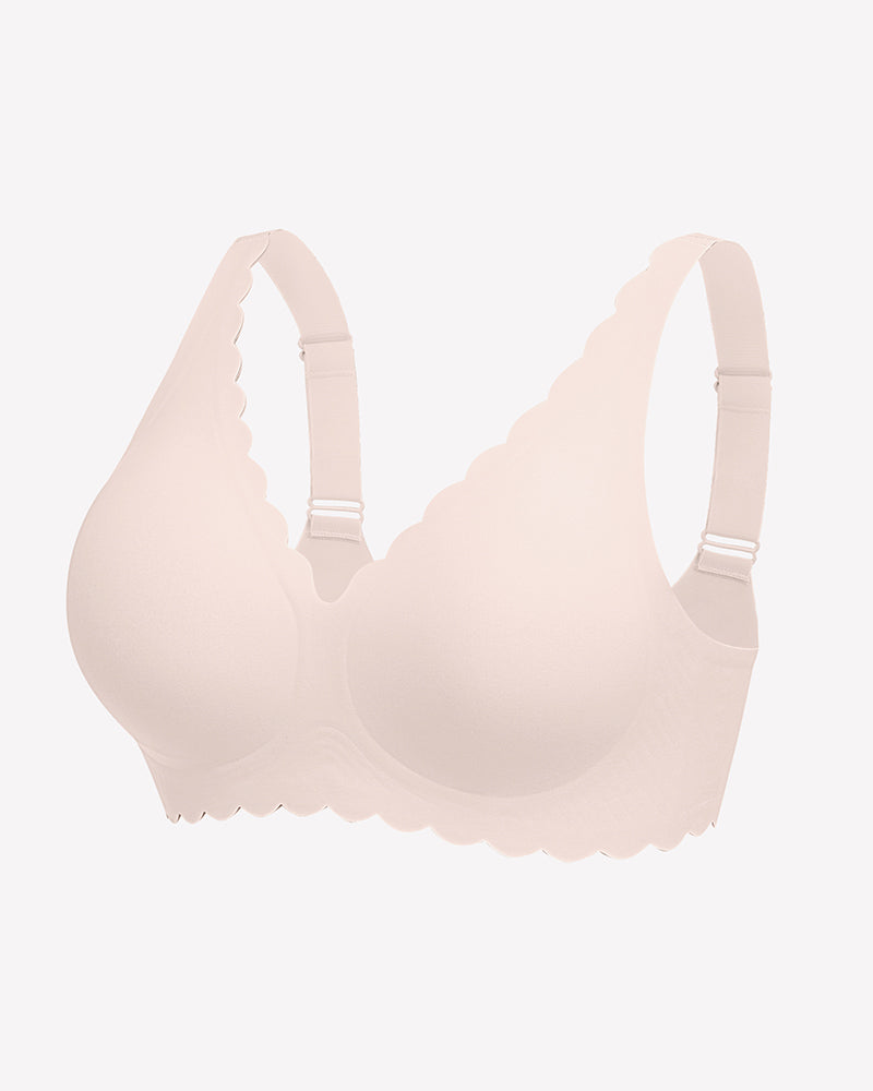 Seamless light pink V-neck bra with scalloped edges, full coverage, and smooth fabric