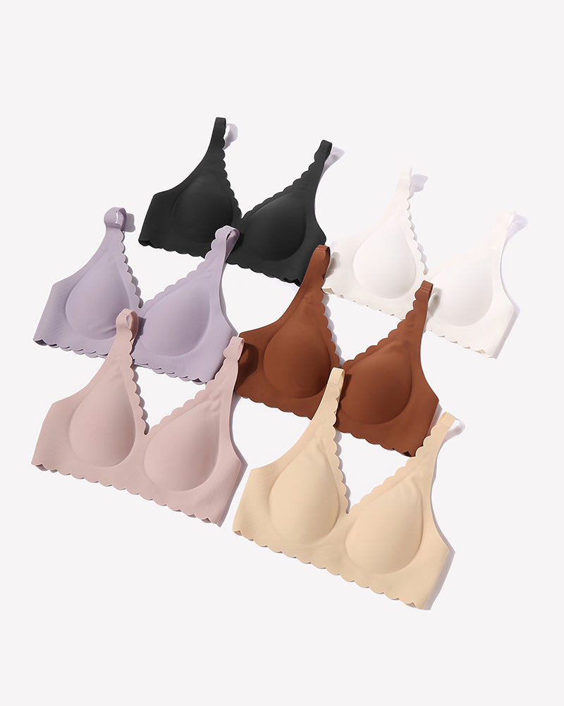 Multi-color seamless V-neck bras with scalloped edges, full coverage, and smooth fabric.