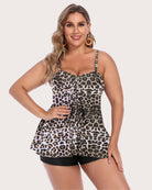 Back view of plus-size model in white polka dot tankini top with black shorts for summer.