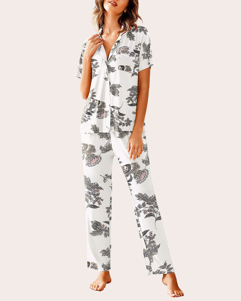 White floral pajamas set: Short-sleeved shirt and long pants. Comfortable sleepwear.