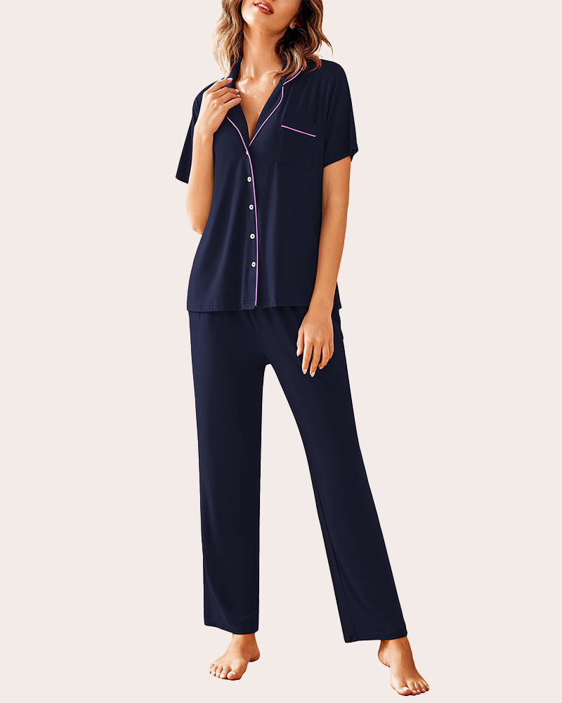 Navy blue pajama set. Button-down shirt and long pants with pink details. Comfortable sleepwear.