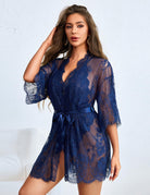 Navy sheer lace robe tied at the waist over a matching bodysuit