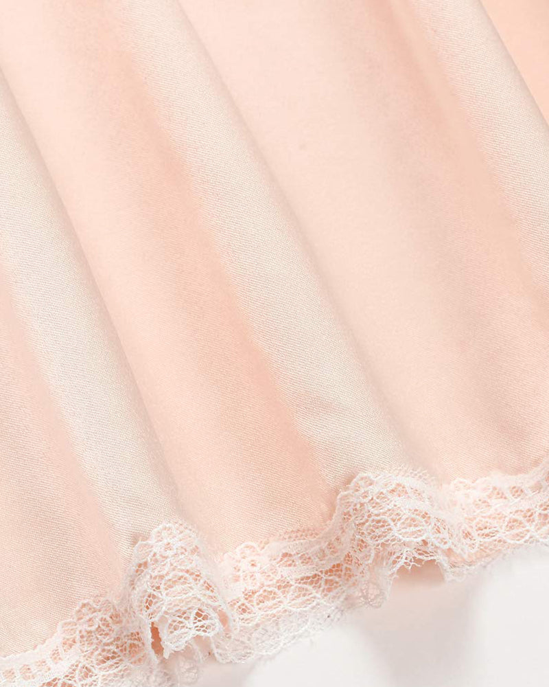 Peach satin half slip with lace trim, elegant long underskirt for women, perfect for layering.