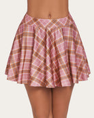 Pink plaid A-line mini skirt, high-waisted, flared design, comfortable schoolgirl style outfit.