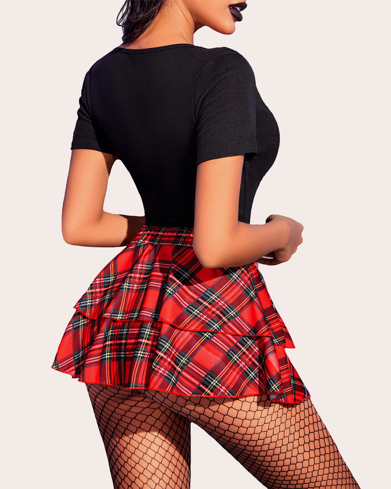 Red plaid mini ruffle skirt with black top, fishnets. Confident and sexy lingerie.
