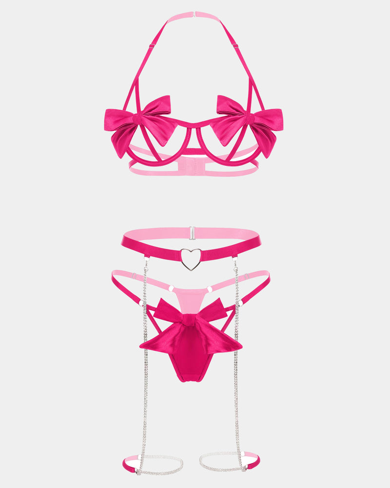 Pink bow lingerie set with underwire bra, heart garter, chain details, and thigh straps.