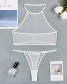 White sheer mesh halter crop top and thong set laid flat