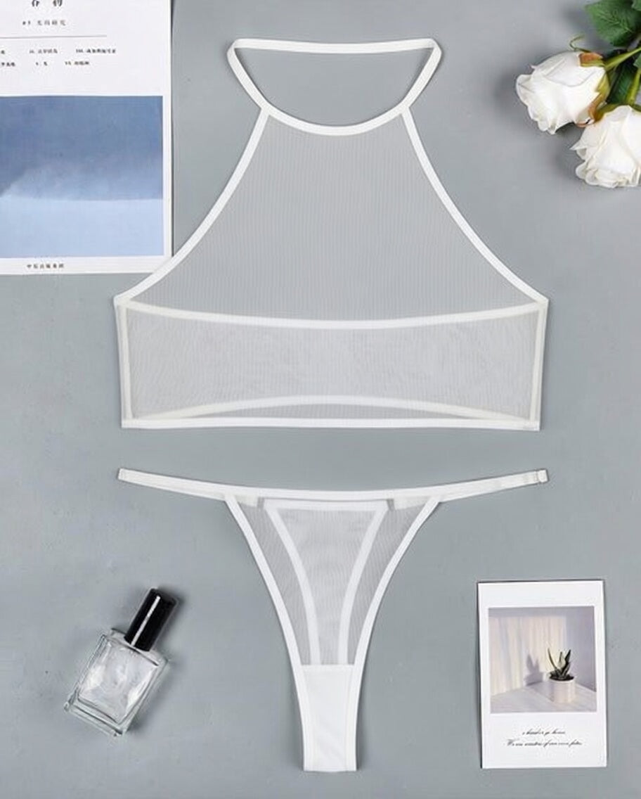 White sheer mesh halter crop top and thong set laid flat