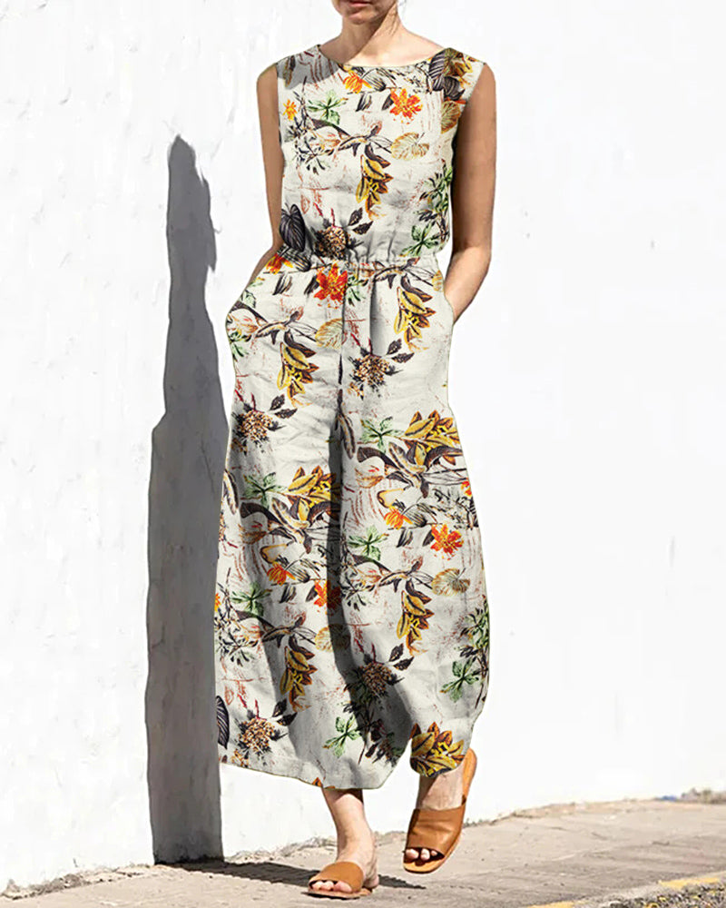Floral print jumpsuit with elastic waist. Casual style, cotton blend, perfect for daily wear.