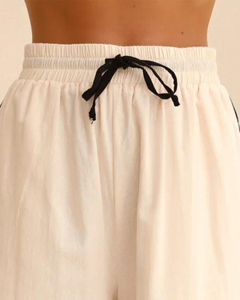 Cream linen shorts waistband with black drawstring, part of the Linen Lace-up Pajama Set.