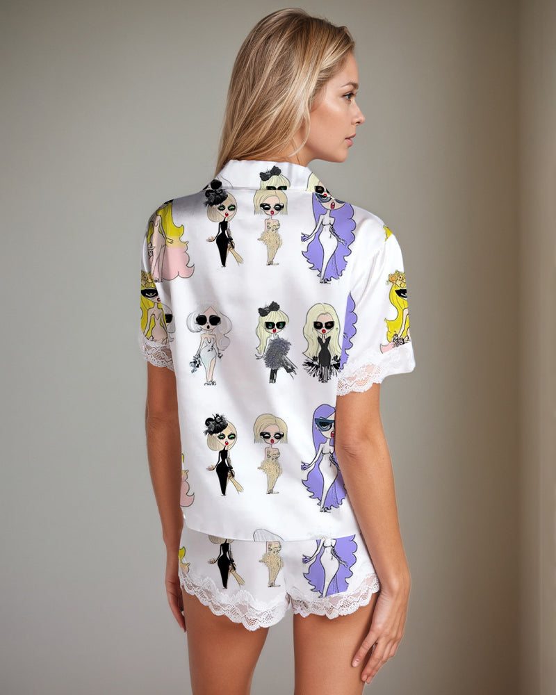 Women's white satin pajama set with doll print, short sleeves, shorts, and lace trim