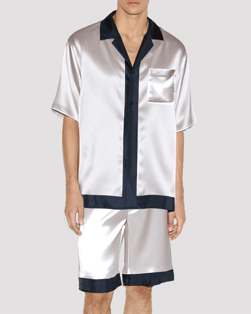 Men's white satin pajama set with navy trim, silk fabric, short-sleeved shirt and shorts