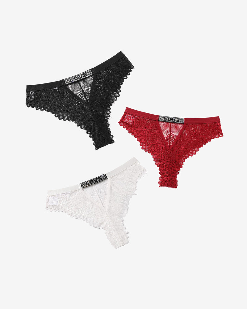 Lace thong panties with rhinestone 'LOVE' detail in black, red, and white. Soft, elegant design.