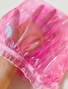 Hot pink sheer brief detail showing translucent fabric and ruffled elastic edge