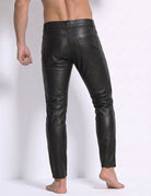 Black faux leather slim pants with stitched seams and plain front fly