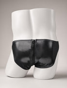 Black faux-leather briefs on mannequin with vertical front zipper and curved pouch