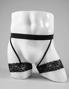 Men's black lace garter thong on mannequin, lace panels and crisscross straps
