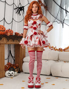 Red-and-white clown dress with ruffled collar and striped leggings, sleeveless