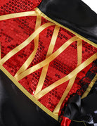 Close-up of red sequin heart bodice with black background, gold laced corset detail