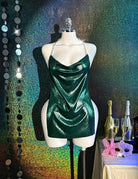 Green holographic metallic bodycon mini dress on mannequin, cowl neck and chain straps