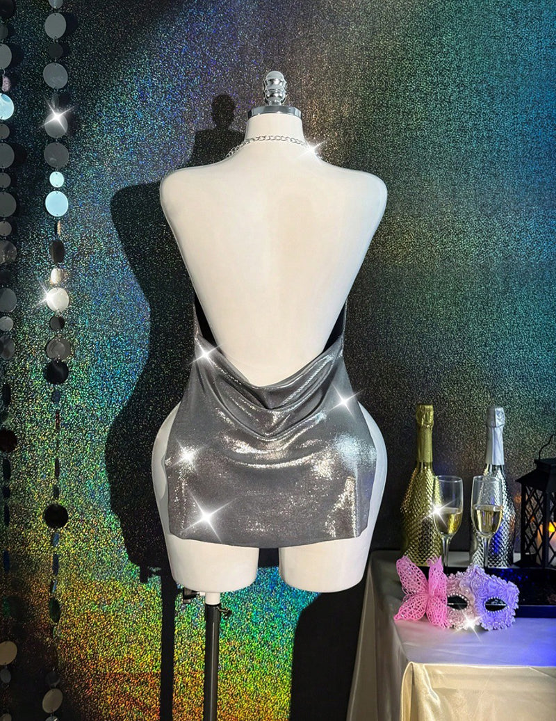 Silver holographic metallic bodycon mini dress on mannequin, open back with cowl neck