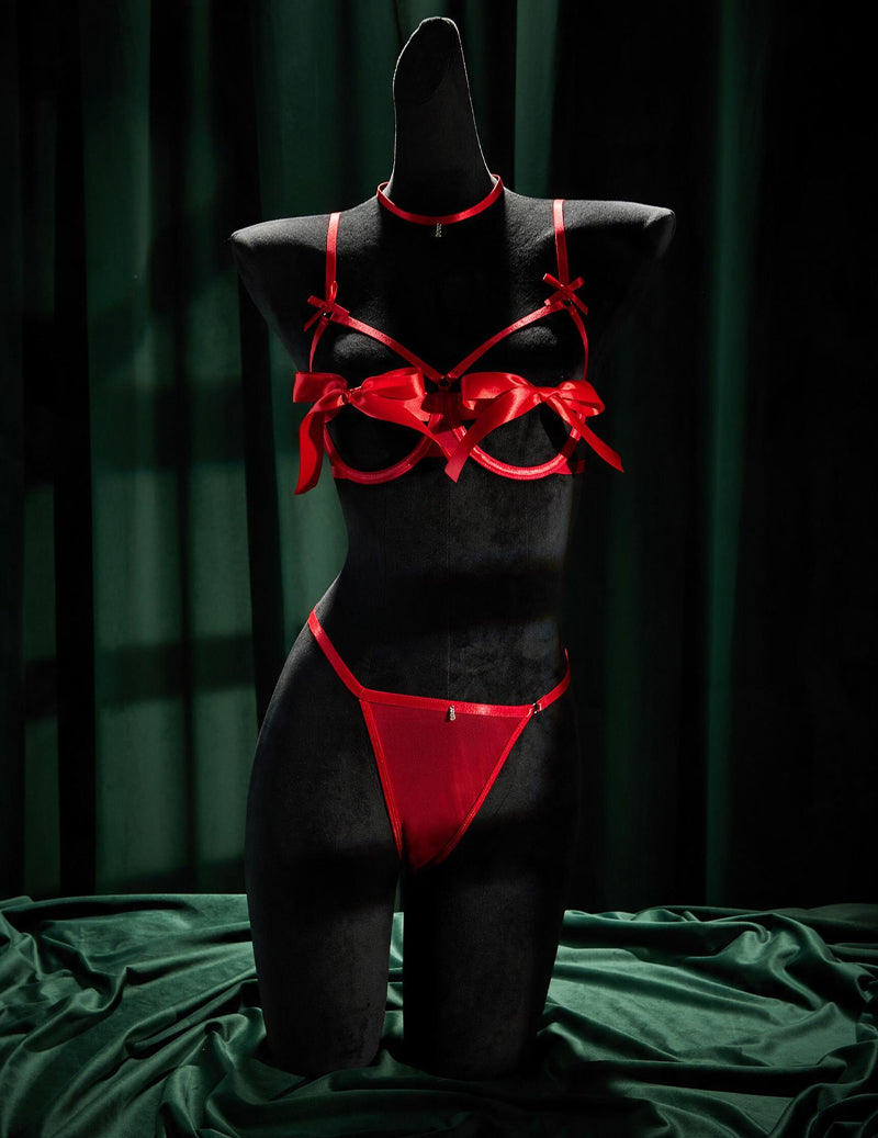 Front view of red satin open-cup bra, thong, and choker set with bows