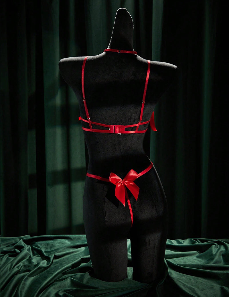 Back view of red lingerie set with adjustable straps and a bow on the thong