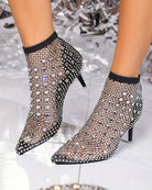 Black rhinestone fishnet mesh pointed-toe kitten heel booties, front view