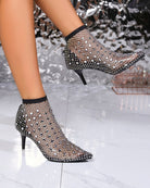 Black rhinestone fishnet mesh pointed-toe booties with kitten heel, side angle