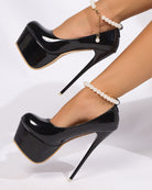 Black patent platform pumps with pearl anklet chain detail and gold-trim sole