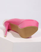 Pink patent platform pump heel with pearl anklet chain detail