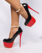 Black patent platform ultra high heel pumps with red base and pearl anklet chain