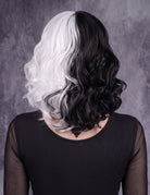 Black and white wavy bob wig with curled sides and split color at the crown