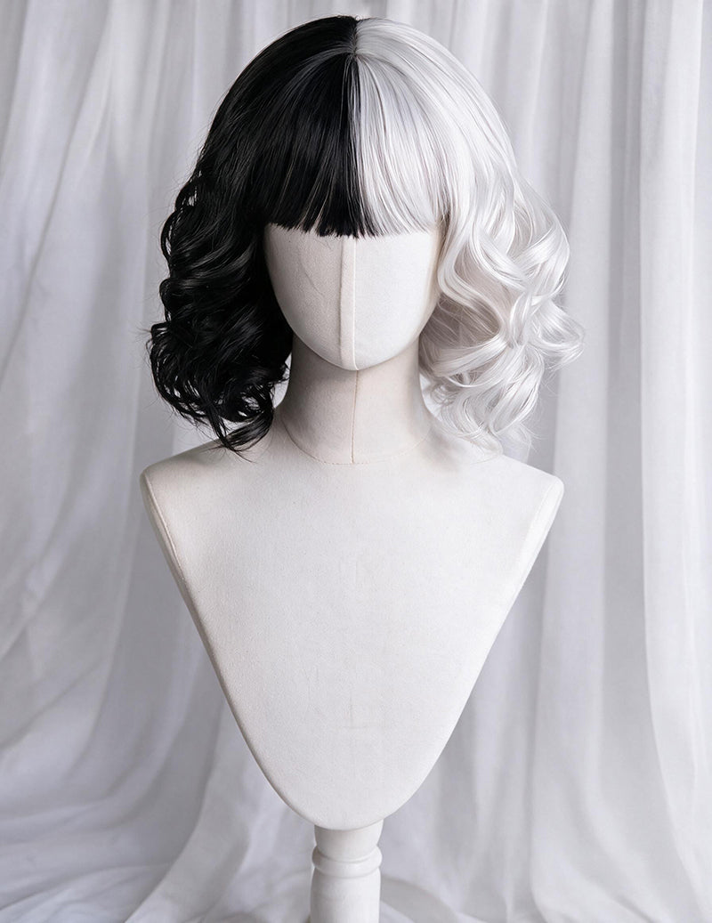 Black-and-white split bob wig with straight bangs and wavy curls on mannequin
