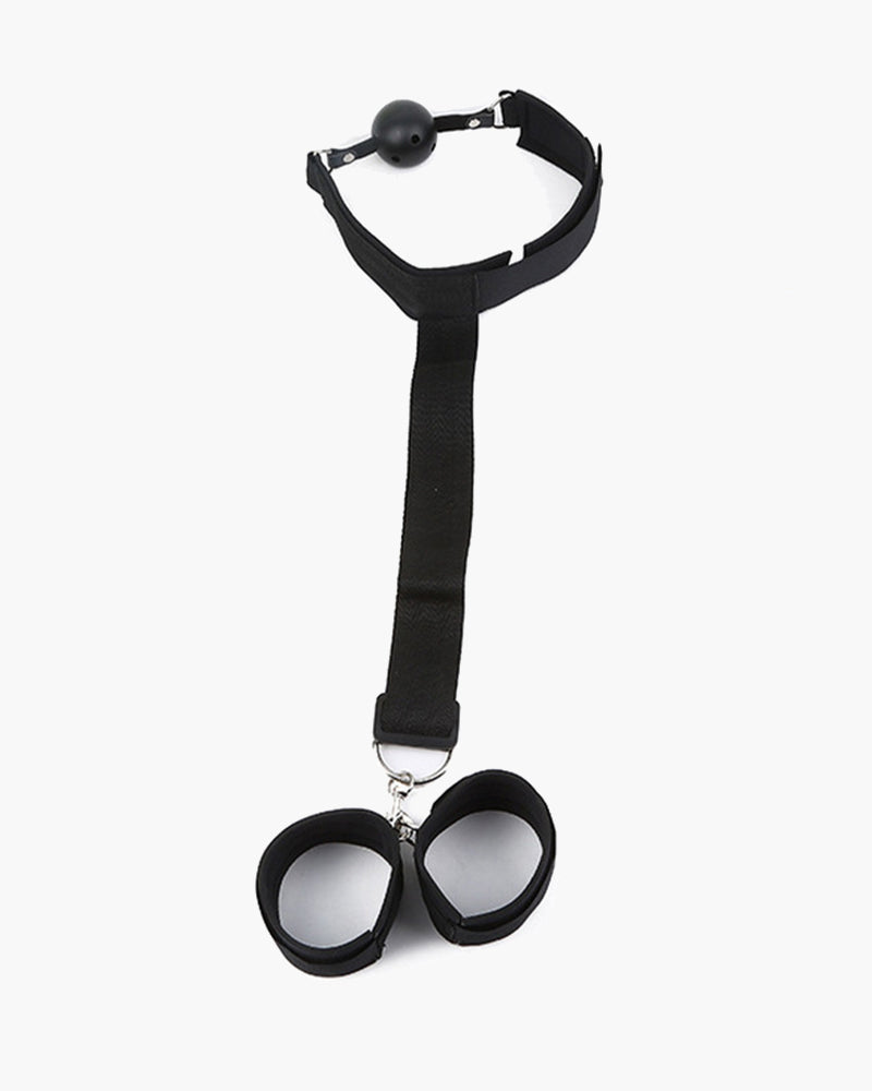 Adjustable black restraint set with ball gag and wrist restraints for intimate exploration.