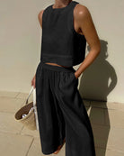 Black linen crop top and wide leg pants set. Comfortable and stylish summer outfit for women.