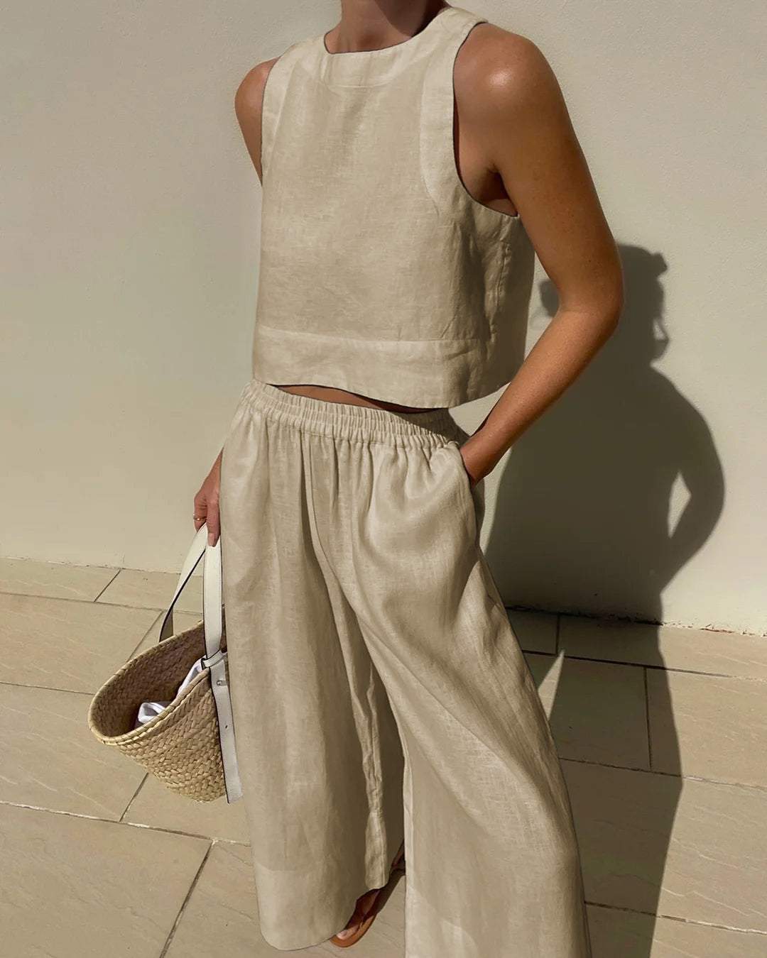 Beige linen crop top and wide leg pants set. Vacation style, breathable linen outfit for summer.