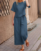 Teal blue linen two-piece set. Comfortable loose fit top and wide leg pants, casual outfit.