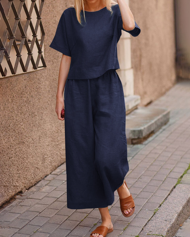 Navy blue linen two-piece set for women, casual style, loose fit top and wide leg pants.