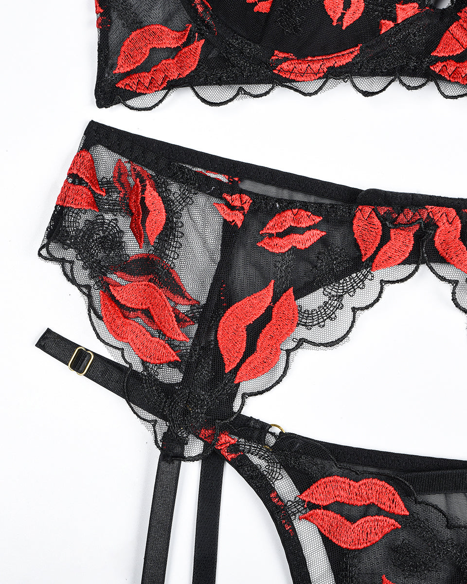 Black lace lingerie set with red lip embroidery; bra, garter belt, and thong with adjustable straps