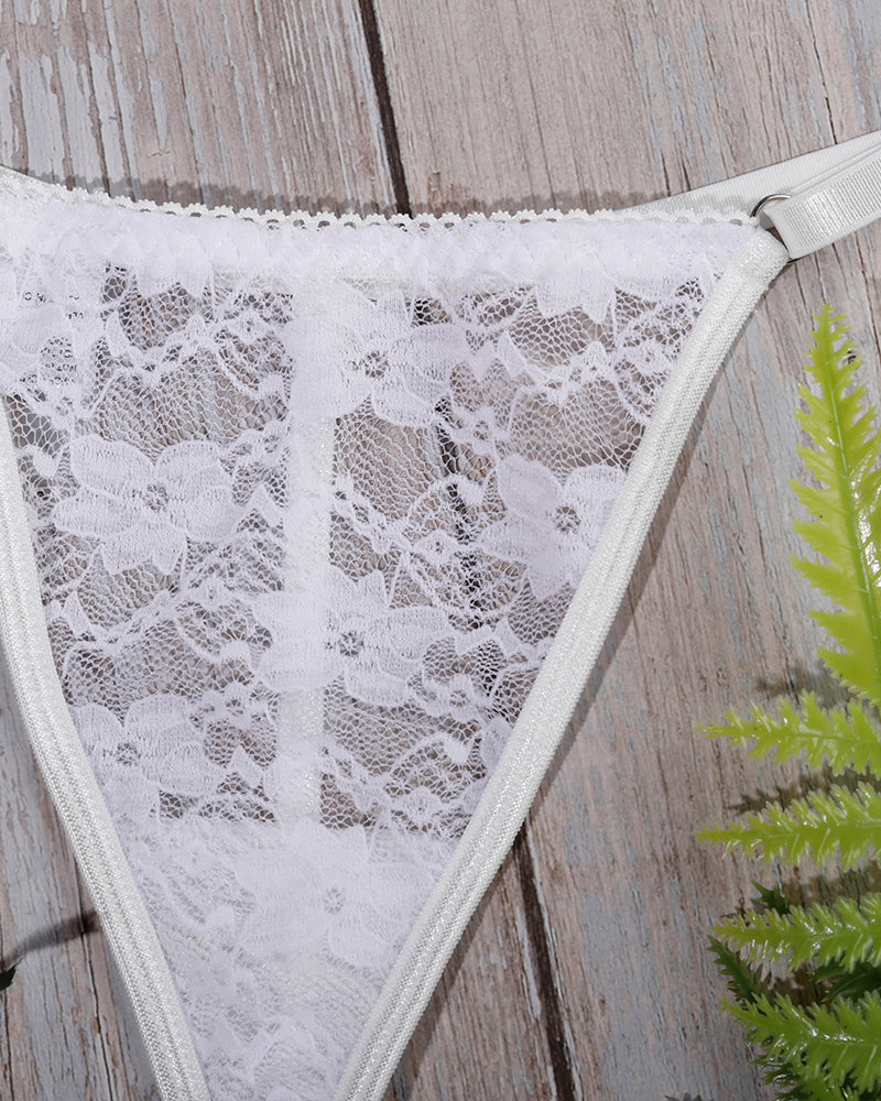 White lace thong with delicate floral lace details, part of a sexy lingerie set.