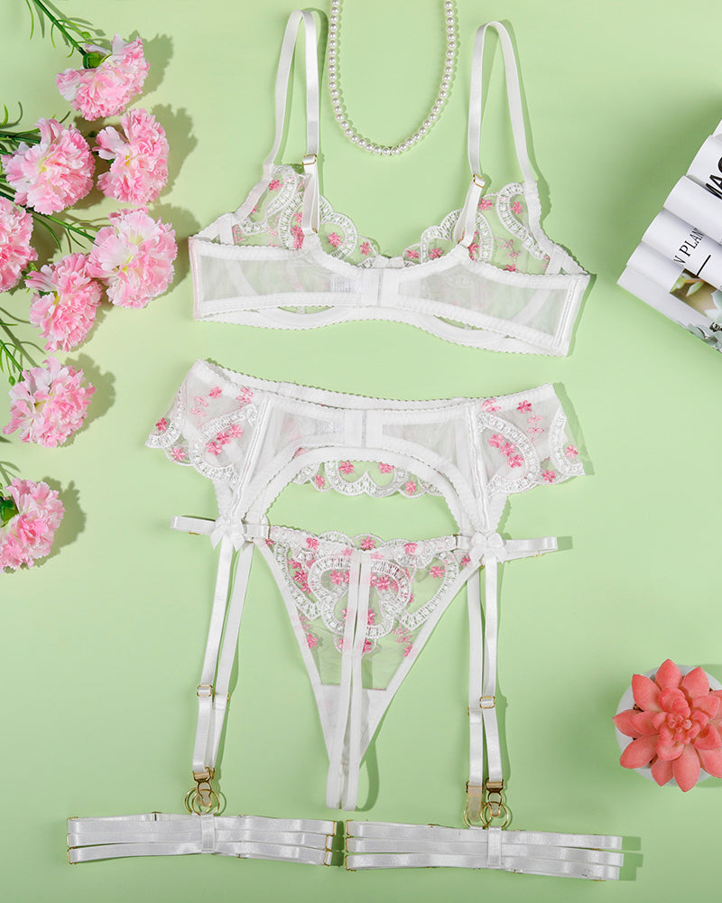 White embroidered heart lingerie set with adjustable straps, offering a sweet yet seductive allure.