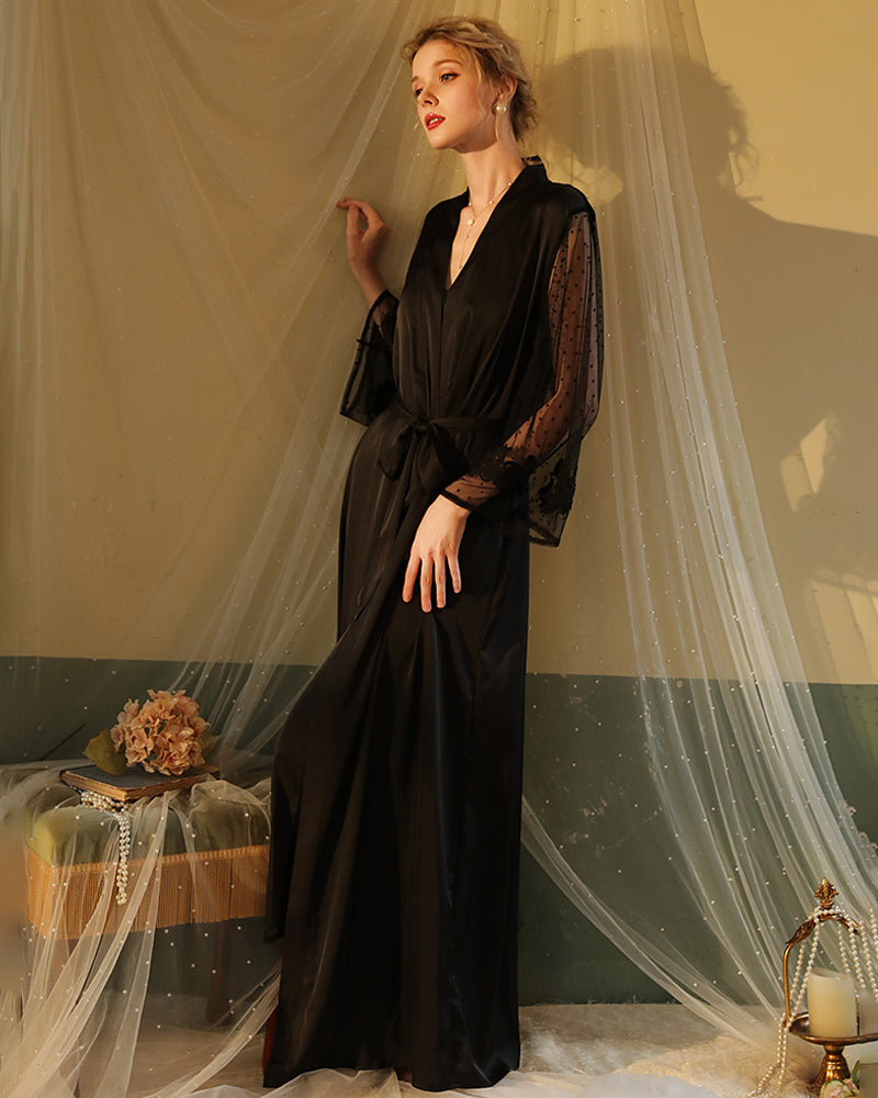 Black satin night robe with lace sleeves, perfect for relaxing evenings. Silky, elegant loungewear.
